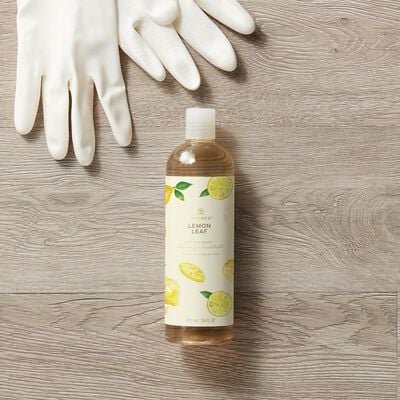 Thymes Lemon Leaf All Purpose Cleaning Concentrate to Clean and Freshen Your Home on top of sponges and bubbles